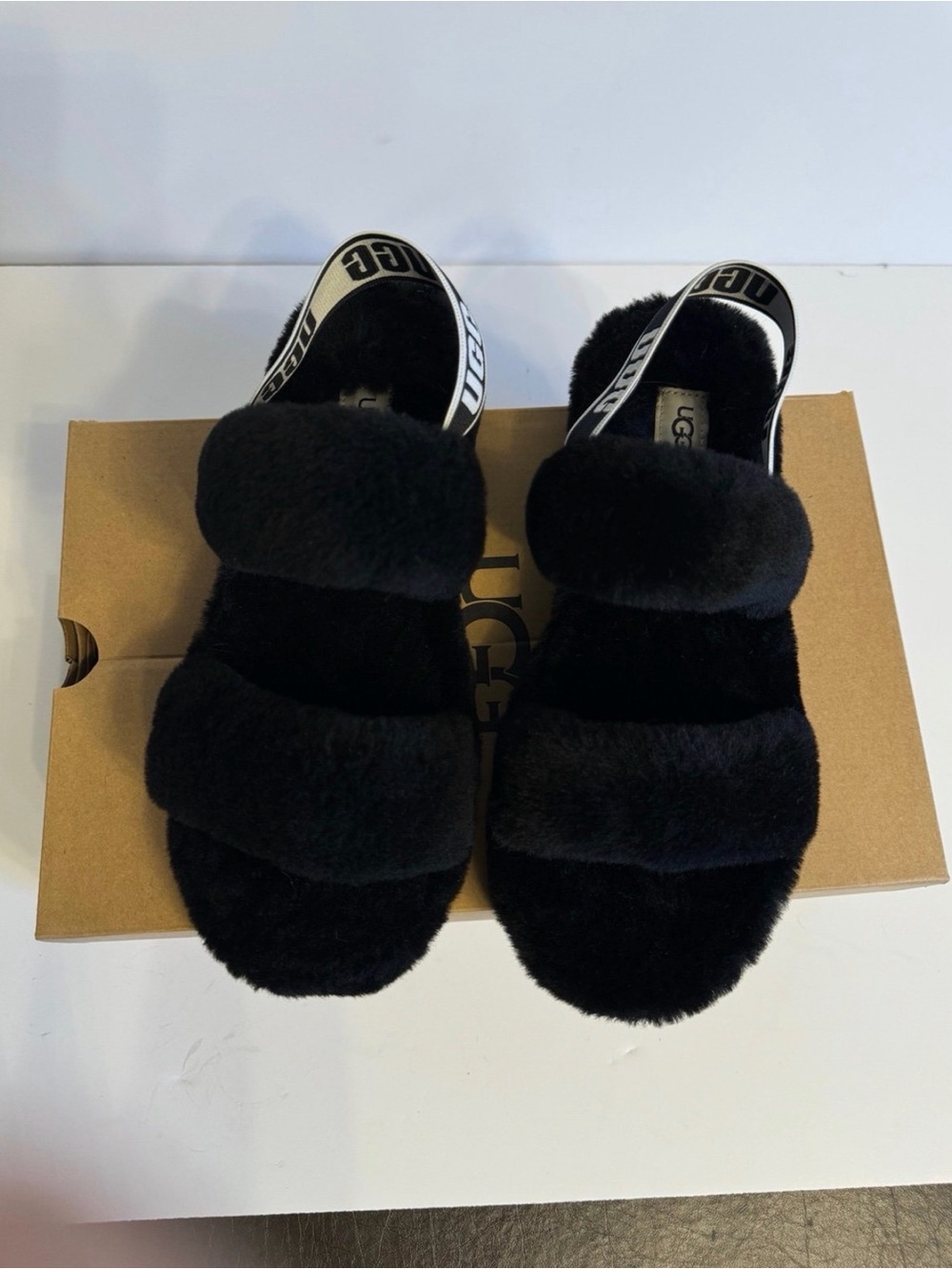 UGG women’s Black Fuzzy Double-Strap Slide Sandals with Branded Heel